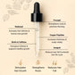 Hair growth serum dropper with labeled ingredients on a beige background